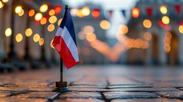 French flag on cobblestone street at night photo