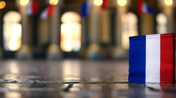 French flag on ground, blurred background photo