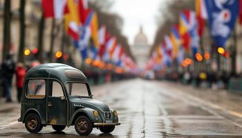 Miniature car on a Parisian avenue with flags. photo