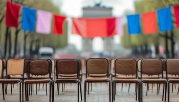 Rows of empty chairs await attendees, Arc de Triomphe in background. photo