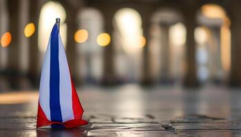 Small Dutch flag on cobblestones photo