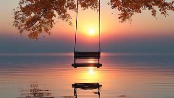 Sunset over calm lake with swing photo
