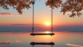 Sunset swing over calm water photo