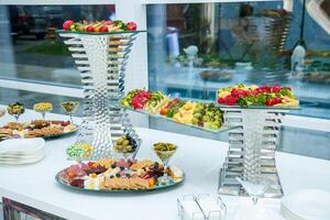 Delicious dish on the buffet table. Cold appetizers from the chef for the celebration photo