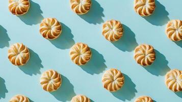 Baked Goods Arranged In A Pattern On A Light Blue Background photo