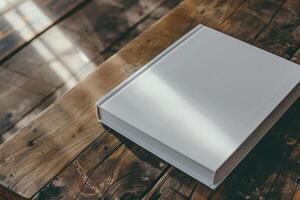 White Book Resting on a Wooden Table, Highlighting a Minimalist and Classic Reading Experience photo