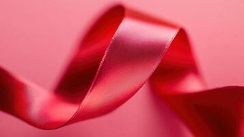 A detailed shot of a bright red ribbon standing out against a differing background photo