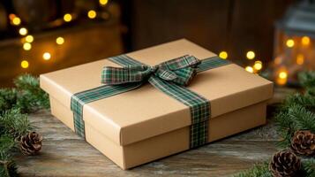 Gift Box with Green Plaid Ribbon on Wooden Surface photo