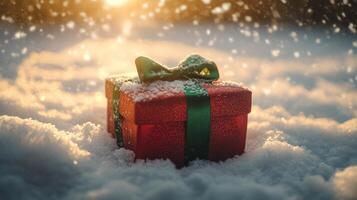 Red Gift Box With Green Bow Covered in Snow photo