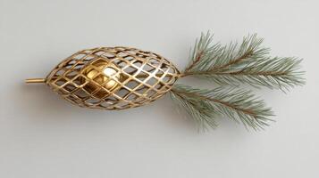 Golden Orb Encased in a Wire Mesh with Pine Branches photo