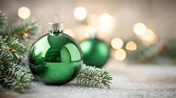 Green Christmas Ornament on a Snowy Surface with Pine Needles photo