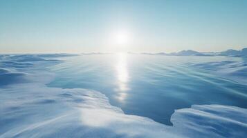A serene arctic landscape with a sunlit blue lake and snow-covered hills photo