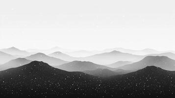 Silhouetted Mountain Range with Snowfall and a White Sky photo