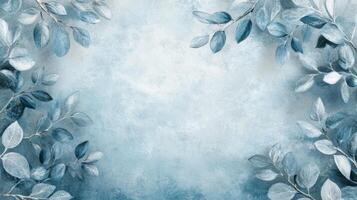 Frosted Blue Leaves Bordering a Light Blue Background photo