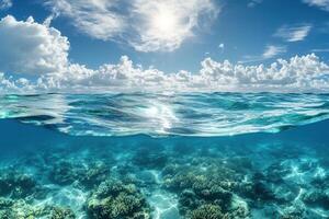 Underwater view of coral reef and ocean surface. photo