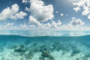 Underwater view of coral reefs and serene ocean surface. photo
