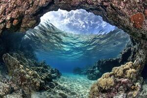 Underwater view through a coral archway. photo