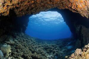 Underwater view through a coral archway. photo