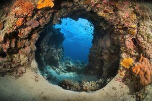 Underwater view through a coral reef opening. photo