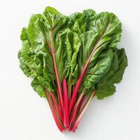 A close-up of bright green beet leaves with a few red accents, displayed against a white background. photo