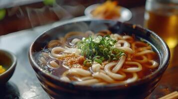 A bowl of noodles with chopsticks and broth photo