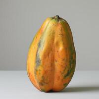 A close-up photo of a fresh, bright yellow and orange fruit.