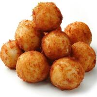 A stack of golden, fried cheese balls with crisp outer coatings, resting on a white surface. photo