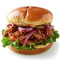 Mouthwatering barbecue sandwich with tomatoes, onions, and pickles, served on a bun. photo
