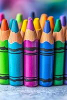 A row of crayons with different colors. The colors are arranged in a line, with the blue crayon in the middle photo