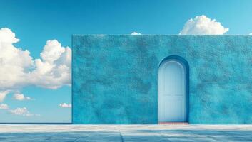 A blue building with a white door and a blue arch. The sky is blue and cloudy. The building is empty and the door is open photo