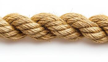 Jute fiber rope, twisted and displayed. A length of jute rope is shown, showcasing its texture and twisted design against a white background. photo