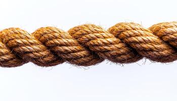 Natural hemp rope used in various applications. Close-up view of thick, braided hemp rope showcasing its texture and strength suitable for crafting and sailing. photo