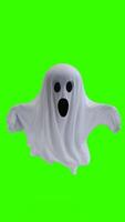 ghost in a white sheet with green background photo