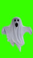 ghost in a white sheet with green background photo
