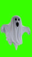 ghost in a white sheet with green background photo