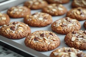 Freshly baked almond cookies cooling on baking sheet photo