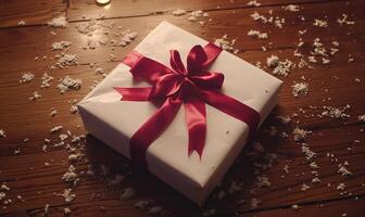 A white box with a red ribbon on top photo