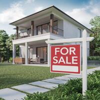 Modern multi level house with FOR SALE sign, lush greenery, and clear sky background For Social Media Post Size photo