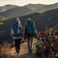 Hikers with large backpacks walk on path through rolling hills in warm afternoon light For Social Media Post Size photo