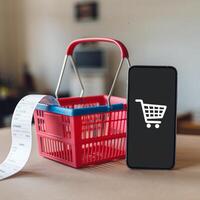 Red shopping basket with receipt beside smartphone displaying cart icon For Social Media Post Size photo