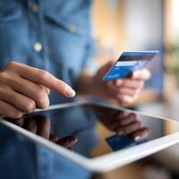 Credit card in hand, sleek tablet use, polished look, digital commerce, blurred background. For Social Media Post Size photo