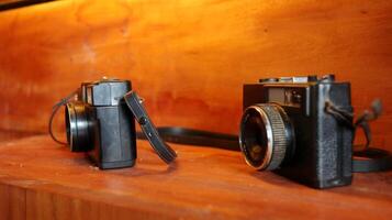 Retro Old camera stack of vintage books photo