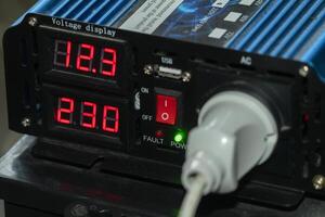 Voltage display device shows power levels and connection status photo