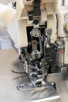 Detailed view of a sewing machine with intricate threading mechanism photo