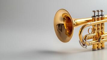 A golden trumpet is shown on a white background photo