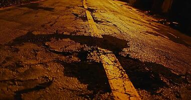 Gritty Asphalt Road at Night with Reflective Lighting and Texture photo