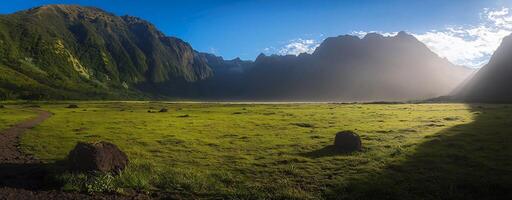 Majestic Mountain Landscape with Lush Meadow and Scenic Panoramic View photo