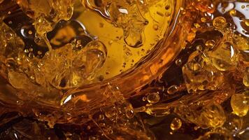 Close up of a glass of orange soda with bubbles photo