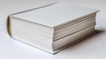 A blank book lies open on a calm surface, waiting to be filled with thoughts and ideas photo