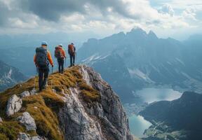 Mountain Hikers Summiting Alpine Peak, Majestic Lake View photo
